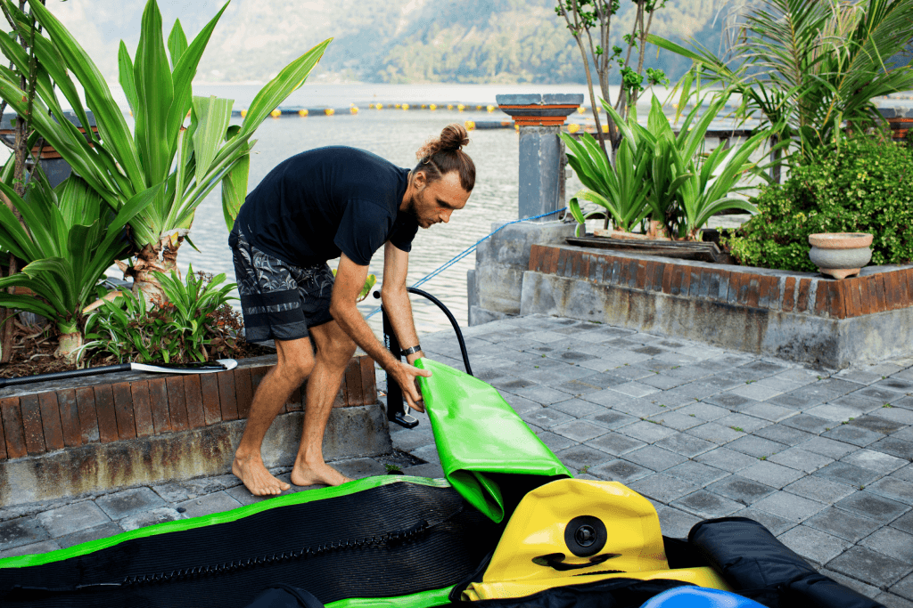 man-takes-out-sup-board