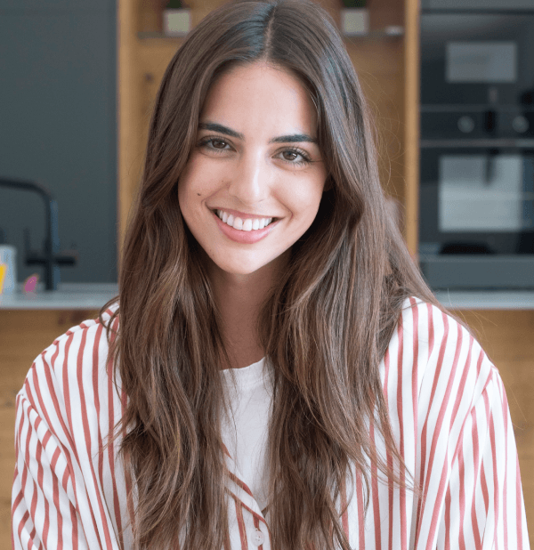 smiling-young-woman-portrait-modern-kitchen-enjoying-relaxed-morning-home (1)